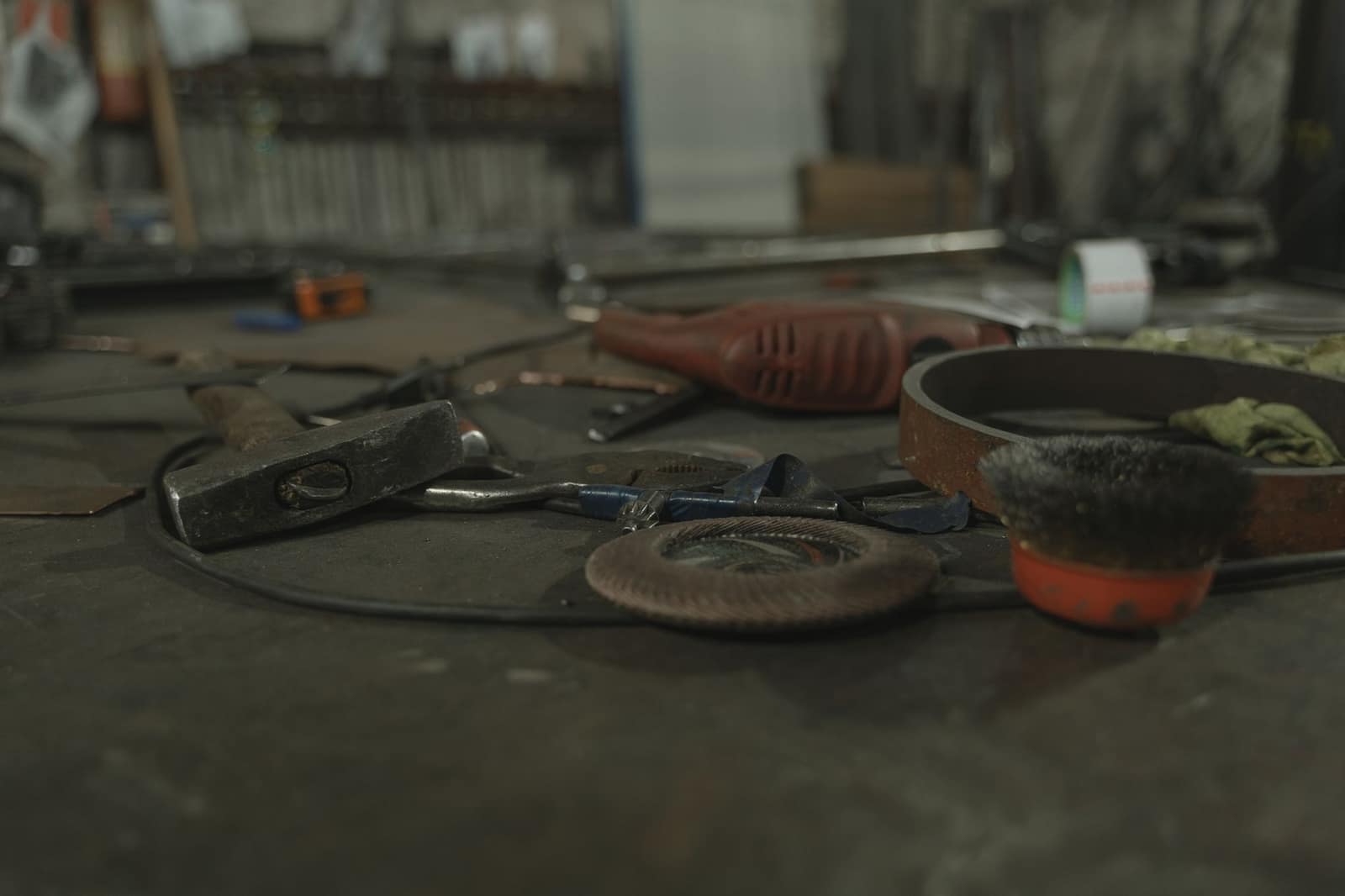 Tools and hardware laid out on a workbench.