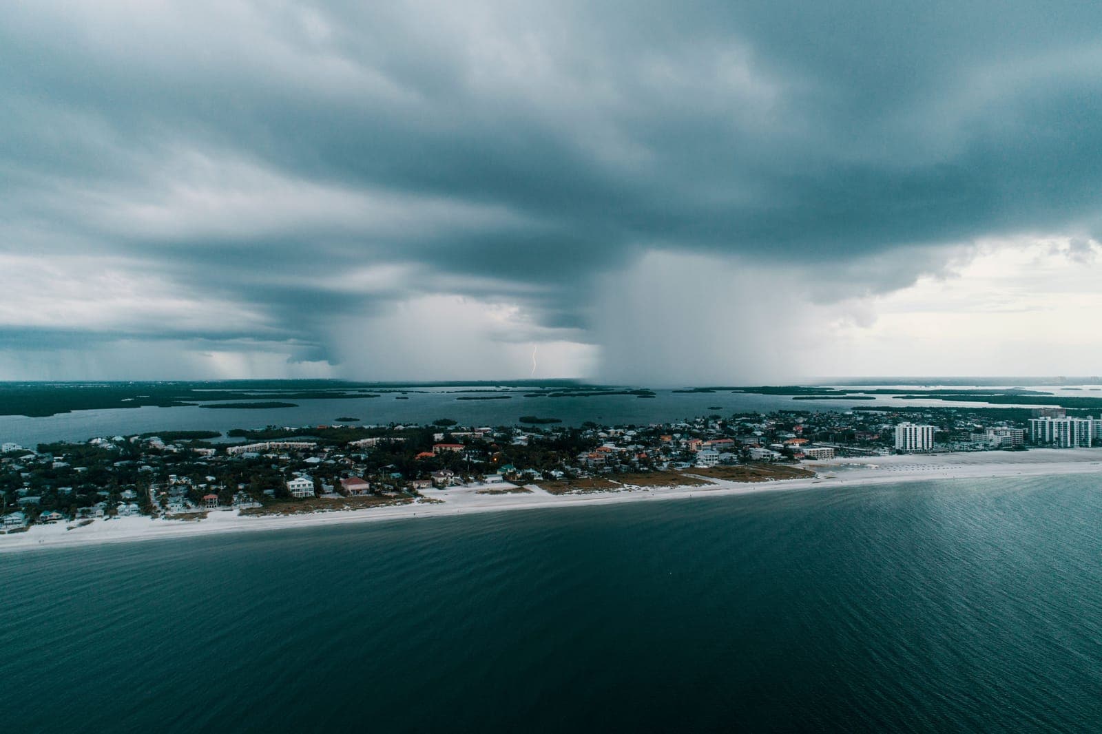 Hurricane storm clouds approaching a coastline.