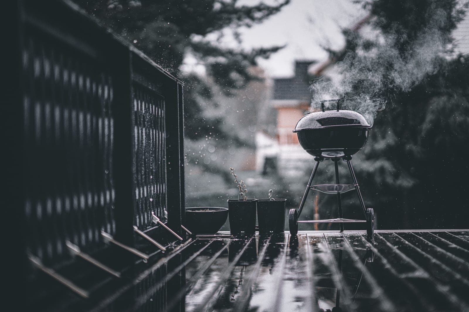 Rain falling on covered outdoor equipment.