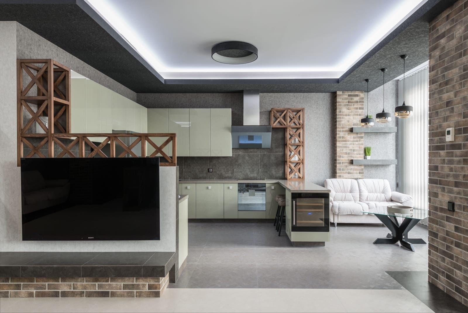 A television and appliances in a dark living room.