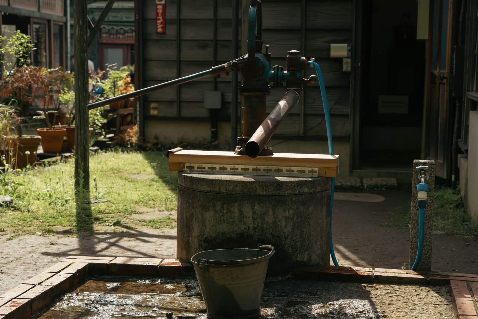 A sump pump installed in a basement pit.