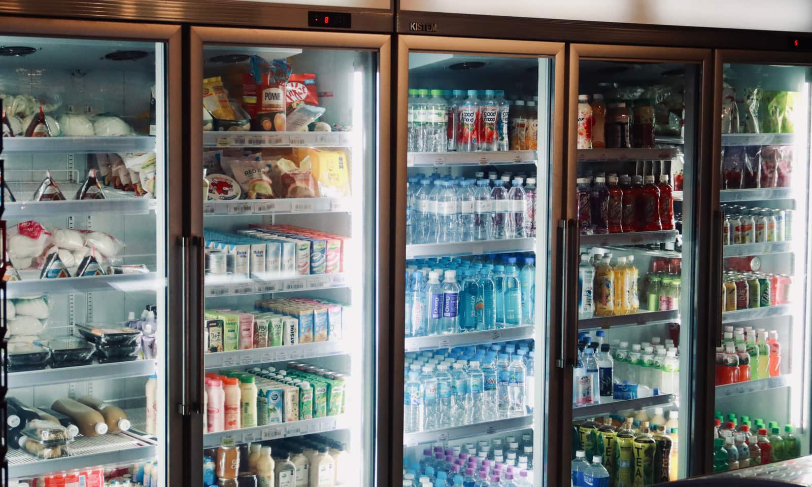 The interior of a refrigerator with food on the shelves.