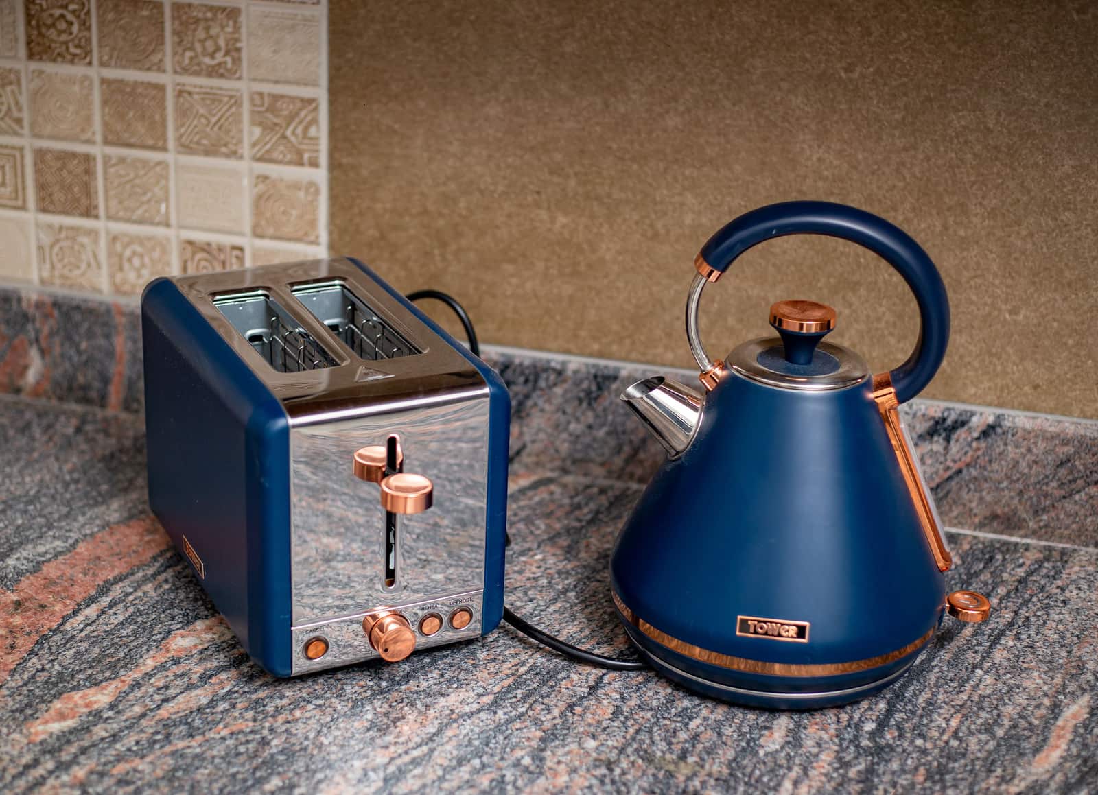 Kitchen counter appliances including a toaster and a kettle.