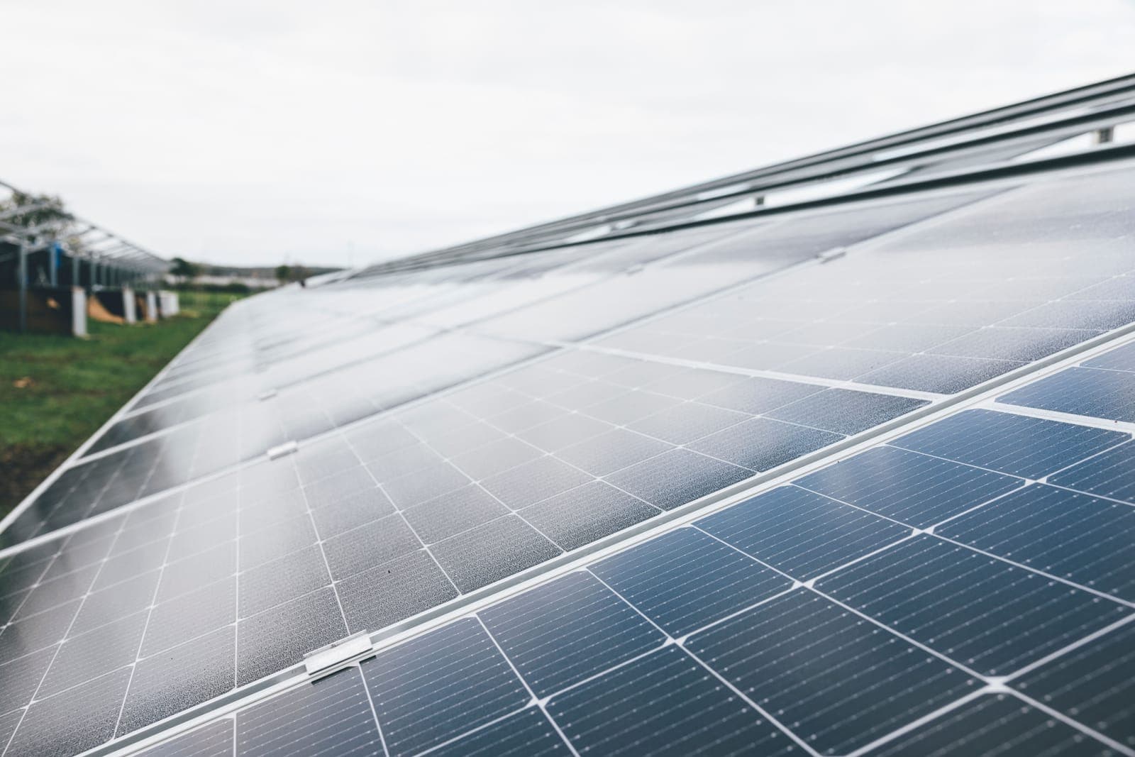 A solar panel under an overcast gray sky.