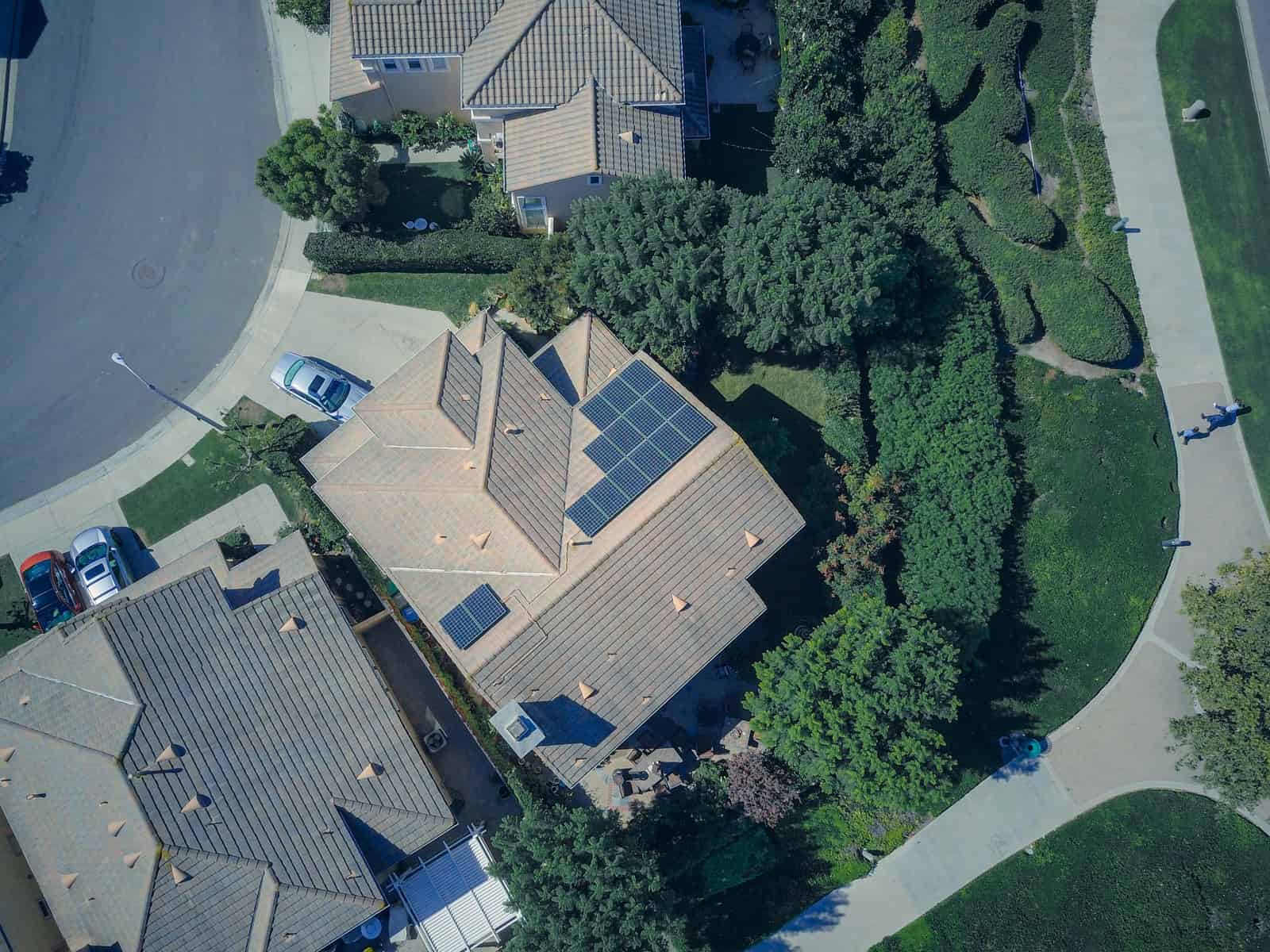 A large standby generator installed beside a house.